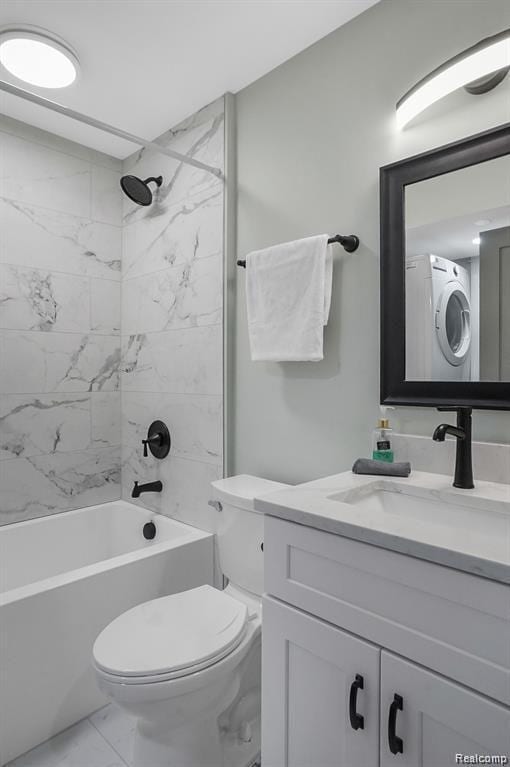 344 Main St Unit 300, Milford, MI 48381 - full bath with marble finish flooring, stacked washing machine and dryer, vanity, toilet, and shower / tub combination