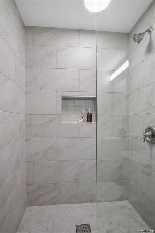 344 Main St Unit 300, Milford, MI 48381 - bathroom featuring a tile shower