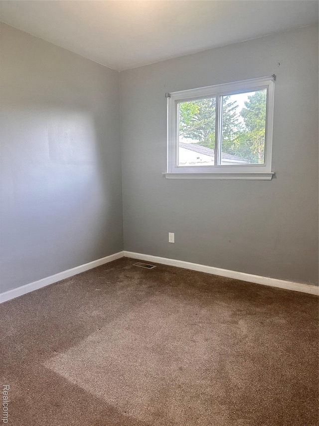 26304 Patricia Ave, Sterling Heights, MI 48091 - carpeted empty room featuring baseboards