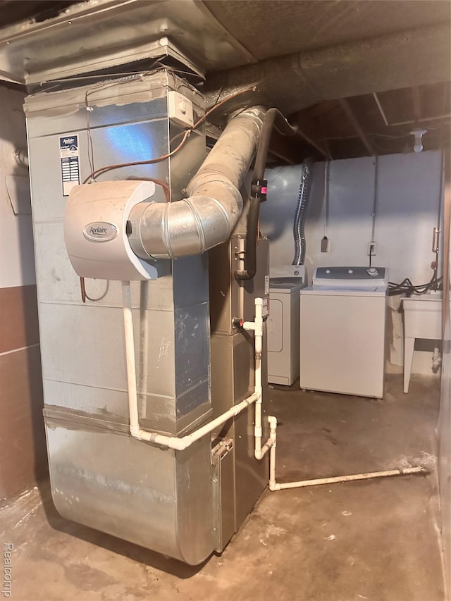 26304 Patricia Ave, Sterling Heights, MI 48091 - utilities with independent washer and dryer and a sink