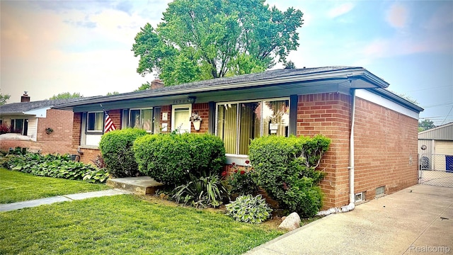 26304 Patricia Ave, Sterling Heights, MI 48091 - ranch-style house featuring brick siding, a front lawn, and a garage