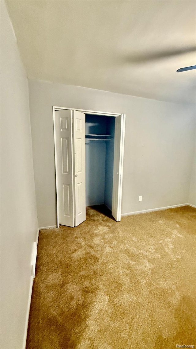 26304 Patricia Ave, Sterling Heights, MI 48091 - unfurnished bedroom featuring carpet floors, baseboards, a closet, and ceiling fan