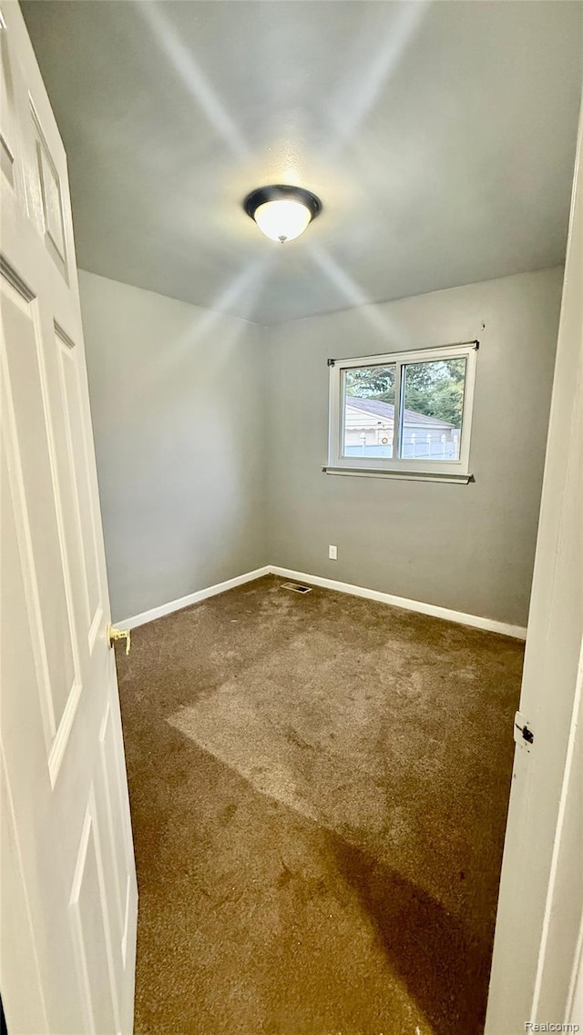 26304 Patricia Ave, Sterling Heights, MI 48091 - spare room with carpet and baseboards