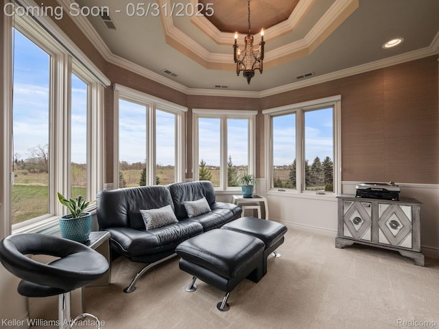20971 Pomino Dr, Northville, MI 48167 - living area featuring a raised ceiling, carpet, a chandelier, healthy amount of natural light, and ornamental molding
