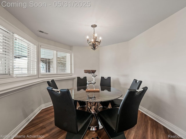 20971 Pomino Dr, Northville, MI 48167 - dining space featuring a chandelier, baseboards, and dark wood finished floors