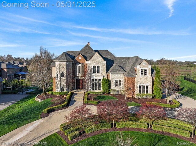 20971 Pomino Dr, Northville, MI 48167 - french country inspired facade featuring stone siding and a chimney