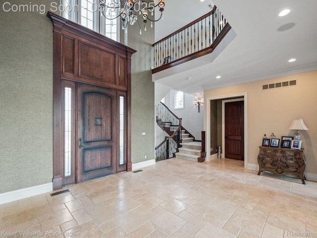 20971 Pomino Dr, Northville, MI 48167 - foyer featuring a chandelier, a high ceiling, baseboards, stairway, and stone tile flooring