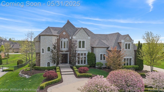 20971 Pomino Dr, Northville, MI 48167 - french provincial home featuring stone siding and a high end roof