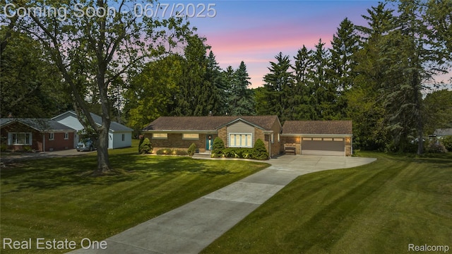 2253 Robell Dr, Commerce Twp, MI 48390 - ranch-style home featuring concrete driveway, a front yard, and a garage