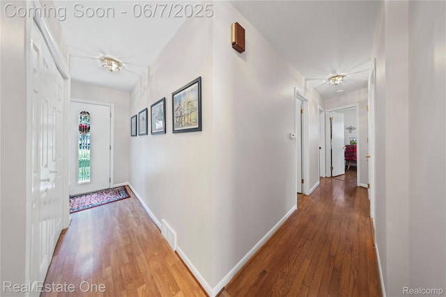 2253 Robell Dr, Commerce Twp, MI 48390 - hall featuring wood finished floors and baseboards