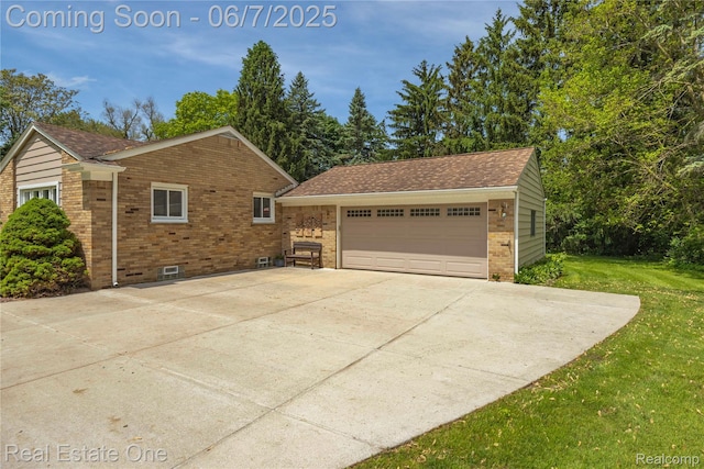 2253 Robell Dr, Commerce Twp, MI 48390 - view of property exterior with brick siding, an outbuilding, a yard, and a detached garage