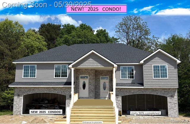 120 Whispering Pines Dr, Fenton, MI 48430 - view of front of home featuring stone siding and an attached garage