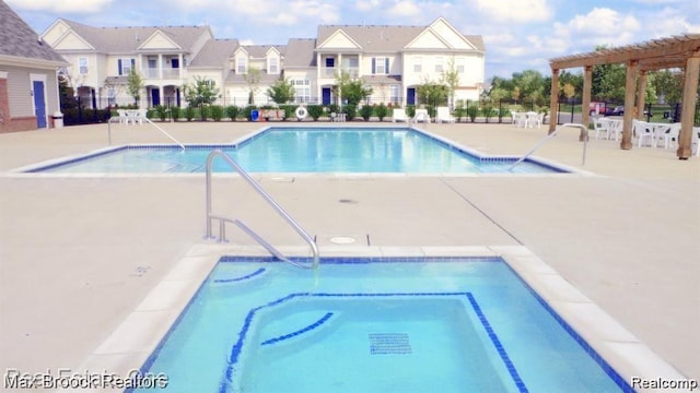 16211 Addington Dr Unit 192, Commerce Twp, MI 48390 - community pool with a residential view, a pergola, and a patio