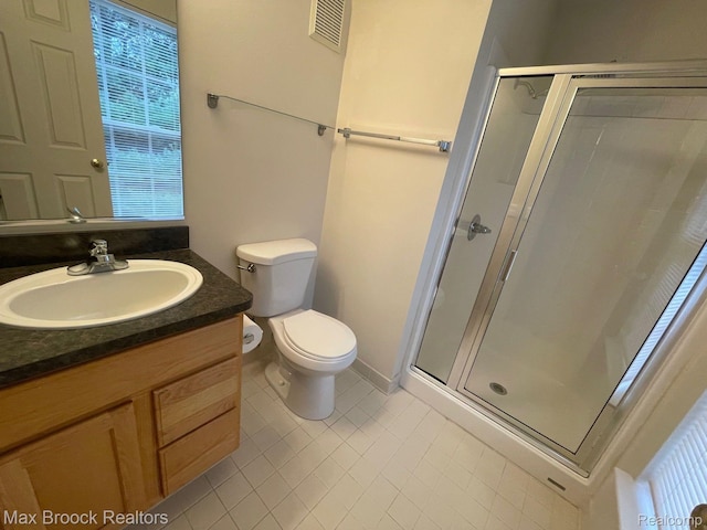 16211 Addington Dr Unit 192, Commerce Twp, MI 48390 - full bathroom featuring a stall shower, vanity, tile patterned flooring, and toilet