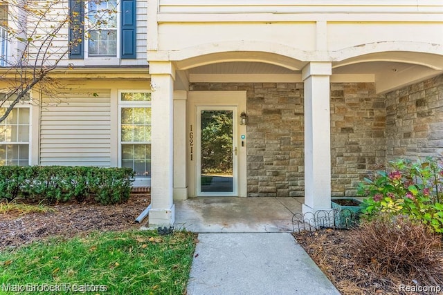 16211 Addington Dr Unit 192, Commerce Twp, MI 48390 - entrance to property featuring stone siding