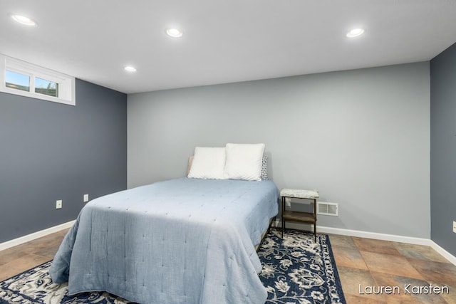 8337 Pebble Dr NE, Rockford, MI 49341 - bedroom featuring recessed lighting, baseboards, and stone tile flooring