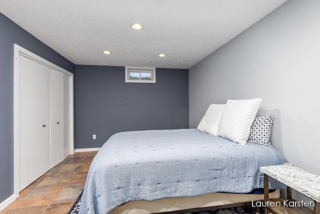 8337 Pebble Dr NE, Rockford, MI 49341 - bedroom with recessed lighting, baseboards, stone finish floors, and a closet