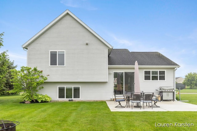 8337 Pebble Dr NE, Rockford, MI 49341 - rear view of house with a patio, a yard, and roof with shingles