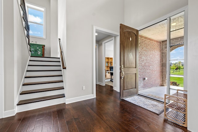 2349 Westbrooke Ct, Ann Arbor, MI 48105 - foyer entrance featuring dark wood-type flooring, stairway, baseboards, and a towering ceiling