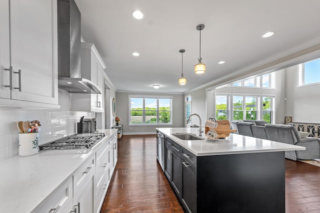 2349 Westbrooke Ct, Ann Arbor, MI 48105 - kitchen featuring wall chimney exhaust hood, a sink, stainless steel gas stovetop, ornamental molding, and dark wood finished floors