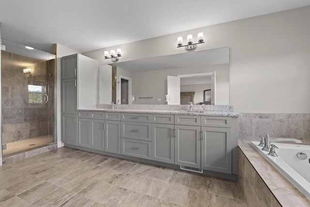 2349 Westbrooke Ct, Ann Arbor, MI 48105 - full bath featuring double vanity, a garden tub, and a stall shower