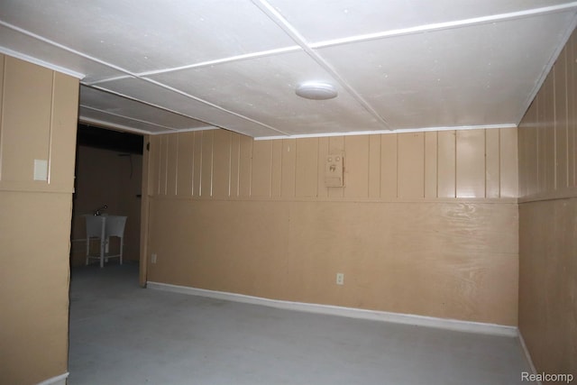 15243 Eastwood St, Detroit, MI 48205 - finished basement with a sink, wooden walls, and baseboards