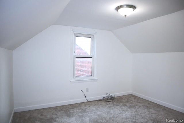 15243 Eastwood St, Detroit, MI 48205 - additional living space with carpet floors, vaulted ceiling, and baseboards