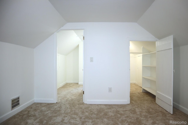 15243 Eastwood St, Detroit, MI 48205 - unfurnished bedroom featuring lofted ceiling, carpet, and a spacious closet