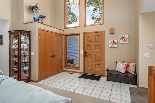 6767 Knollview Dr, Hudsonville, MI 49426 - foyer entrance featuring a high ceiling and light tile patterned floors