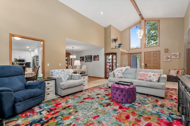 6767 Knollview Dr, Hudsonville, MI 49426 - living area featuring high vaulted ceiling and a chandelier