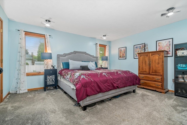 6767 Knollview Dr, Hudsonville, MI 49426 - carpeted bedroom with baseboards and a ceiling fan