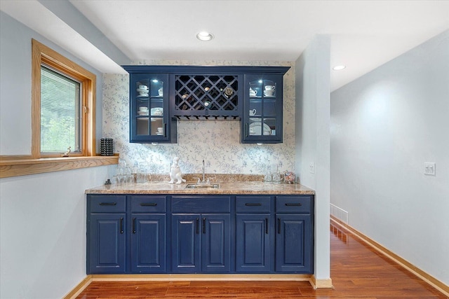 6767 Knollview Dr, Hudsonville, MI 49426 - indoor wet bar with wood finished floors and baseboards