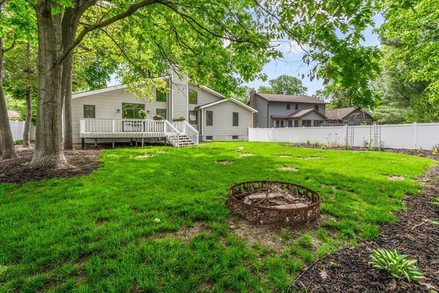 6767 Knollview Dr, Hudsonville, MI 49426 - view of yard with a deck and a fire pit