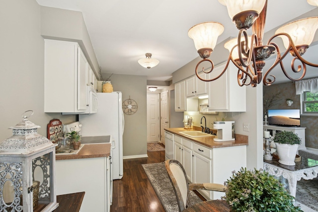 133 Commons Cir, Saline, MI 48176 - kitchen featuring a sink, dark wood-type flooring, dishwasher, white cabinets, and baseboards