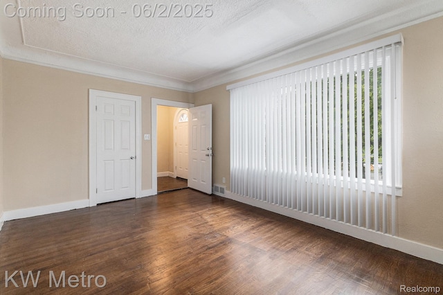 5025 Somerset Ave, Detroit, MI 48224 - empty room featuring dark wood-style flooring, crown molding, and baseboards