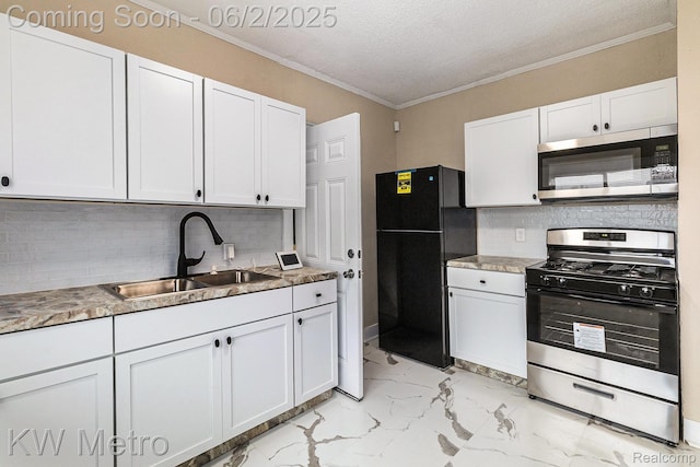 5025 Somerset Ave, Detroit, MI 48224 - kitchen featuring stainless steel appliances, a sink, light marble finish flooring, white cabinets, and tasteful backsplash