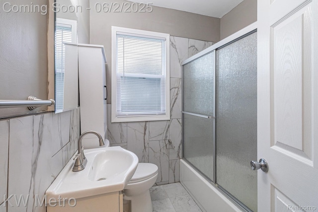 5025 Somerset Ave, Detroit, MI 48224 - full bath featuring marble look tile flooring, toilet, vanity, and enclosed tub / shower combo
