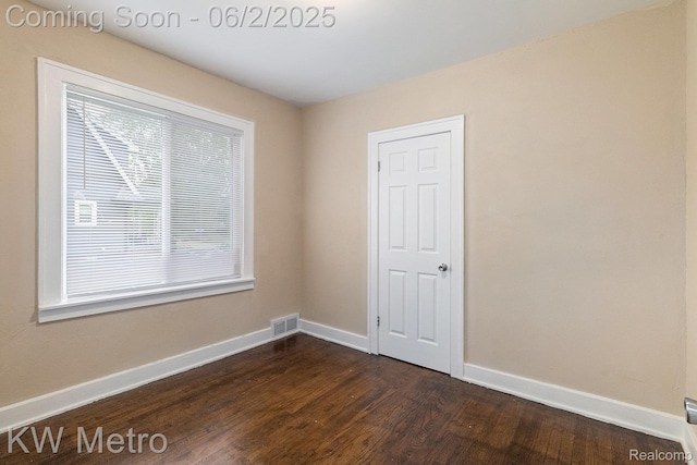5025 Somerset Ave, Detroit, MI 48224 - unfurnished room featuring plenty of natural light, dark wood-style floors, and baseboards