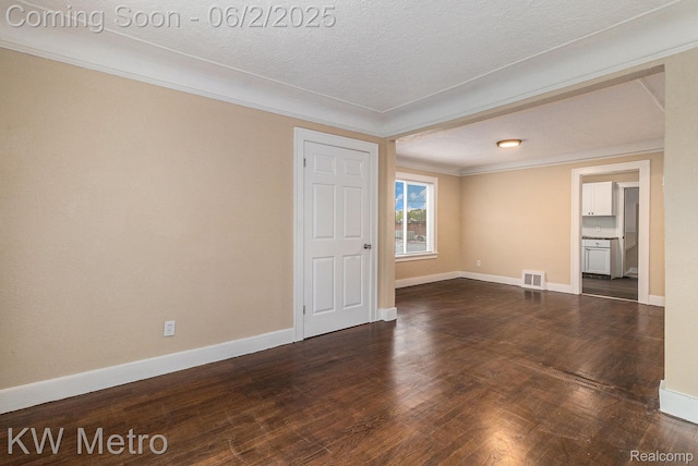 5025 Somerset Ave, Detroit, MI 48224 - empty room with baseboards, dark wood-type flooring, crown molding, and a textured ceiling