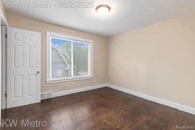 5025 Somerset Ave, Detroit, MI 48224 - empty room featuring dark wood-type flooring and baseboards