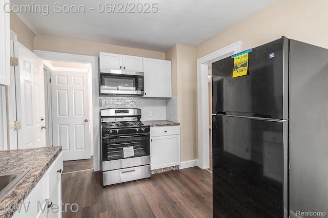 5025 Somerset Ave, Detroit, MI 48224 - kitchen with appliances with stainless steel finishes, dark wood-type flooring, and white cabinetry