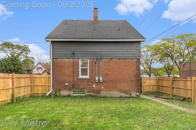 5025 Somerset Ave, Detroit, MI 48224 - rear view of house featuring a chimney, a shingled roof, and brick siding
