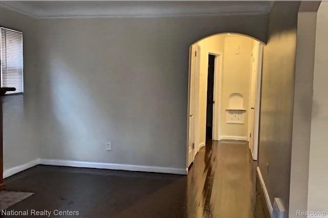 8227 Coyle St, Detroit, MI 48228 - unfurnished room featuring arched walkways, baseboards, and wood finished floors