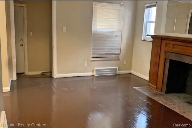 8227 Coyle St, Detroit, MI 48228 - unfurnished living room with baseboards and a fireplace with flush hearth