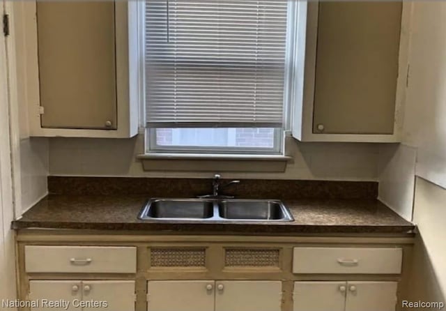 8227 Coyle St, Detroit, MI 48228 - kitchen with a sink and dark countertops