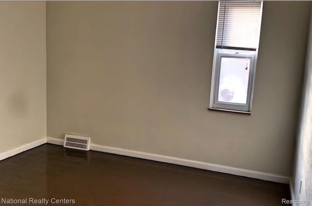 8227 Coyle St, Detroit, MI 48228 - spare room featuring baseboards and concrete flooring