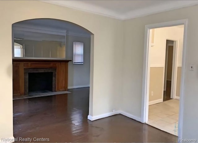 8227 Coyle St, Detroit, MI 48228 - unfurnished living room with baseboards, a fireplace with flush hearth, and arched walkways