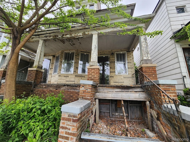 5120 Mcdougall St, Detroit, MI 48211 - doorway to property featuring covered porch