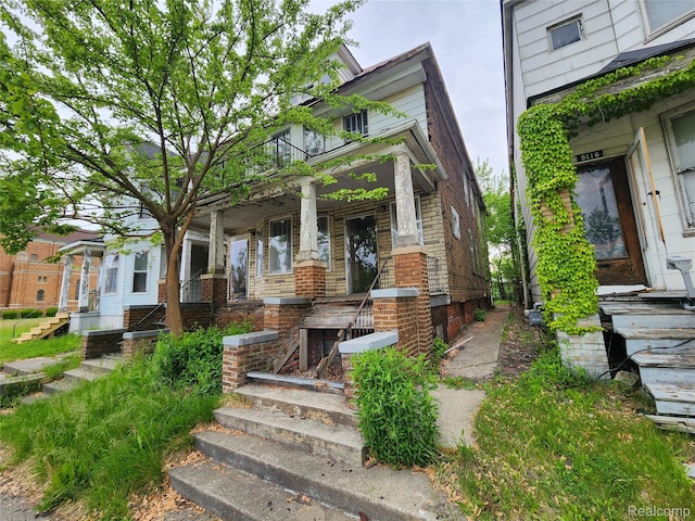 5120 Mcdougall St, Detroit, MI 48211 - view of front facade with covered porch and brick siding