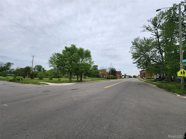 5120 Mcdougall St, Detroit, MI 48211 - view of asphalt road with street lighting and curbs